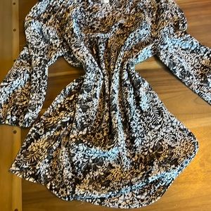 Lauren Conrad Look flawless in this sheer flowy blouse.